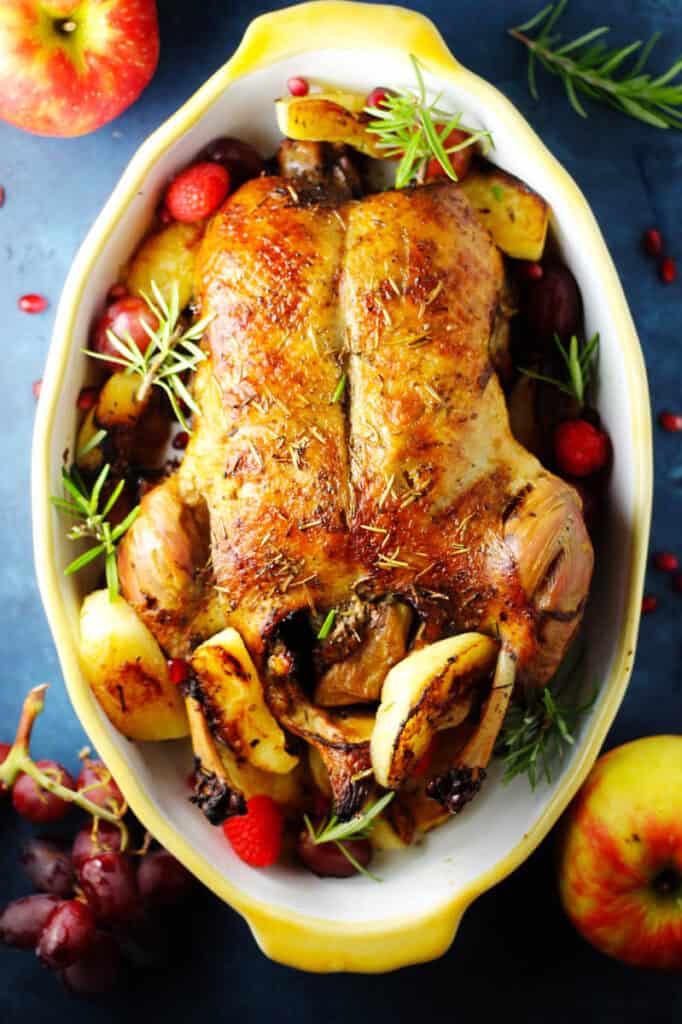 Overhead of roasted duck stuffed with apples