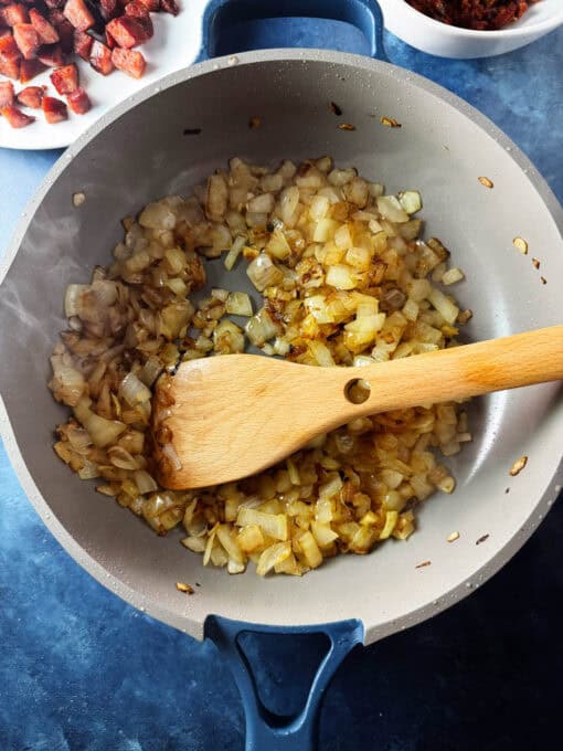 Golden brown cooked onions in the skillet
