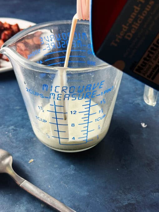 Soup and milk in a glass jug