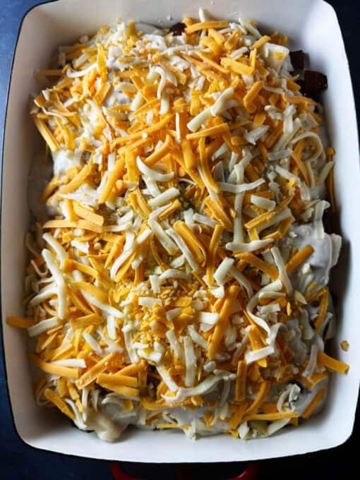 Shredded cheese is added to the top