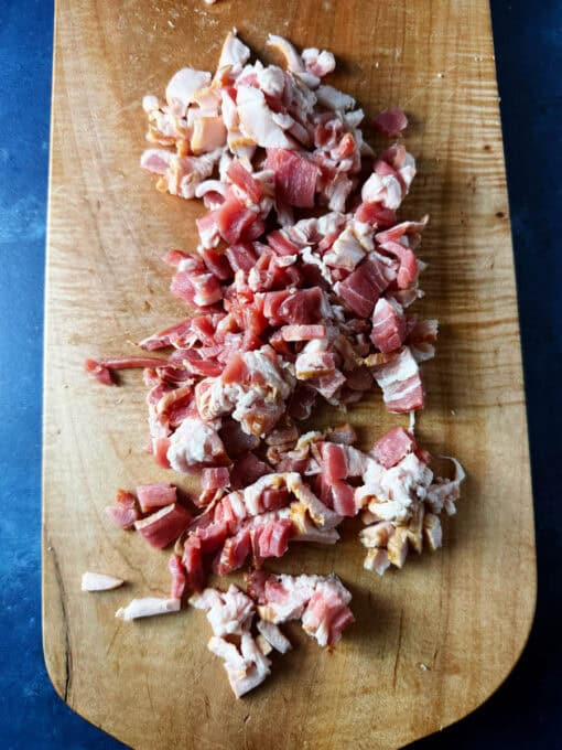 Chopped up bacon on a cutting board