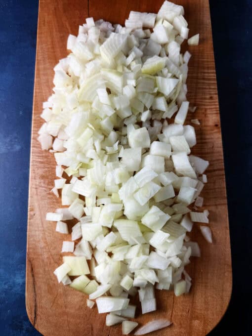 Chopped up onion on a cutting board