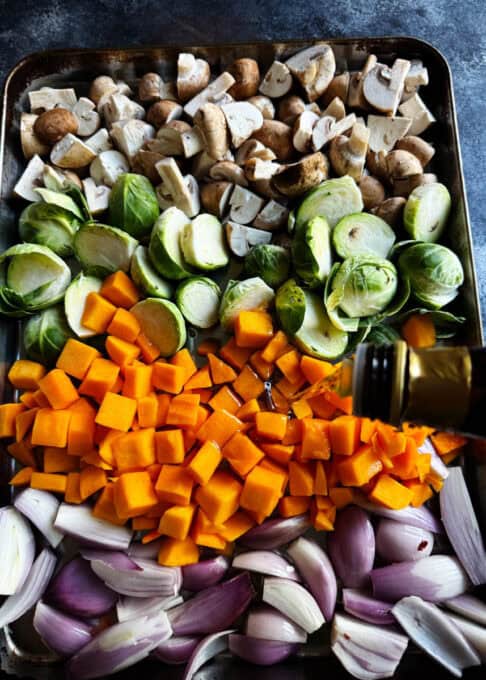 All the vegetables on the baking sheet