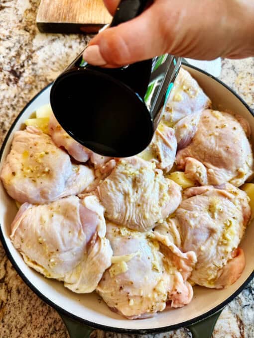 Adding broth to the dish
