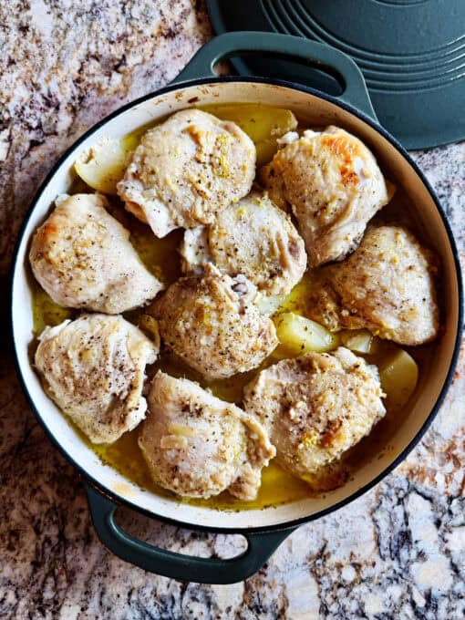 Baking dish of cooked chicken and potatoes