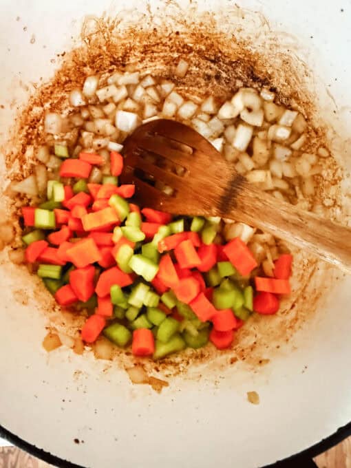 Cooking carrots and celery in pan