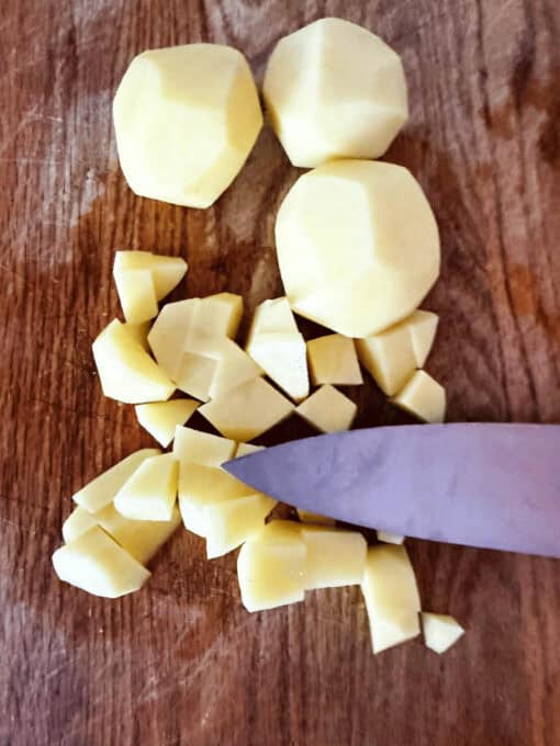 Chopped up potatoes on a cutting board